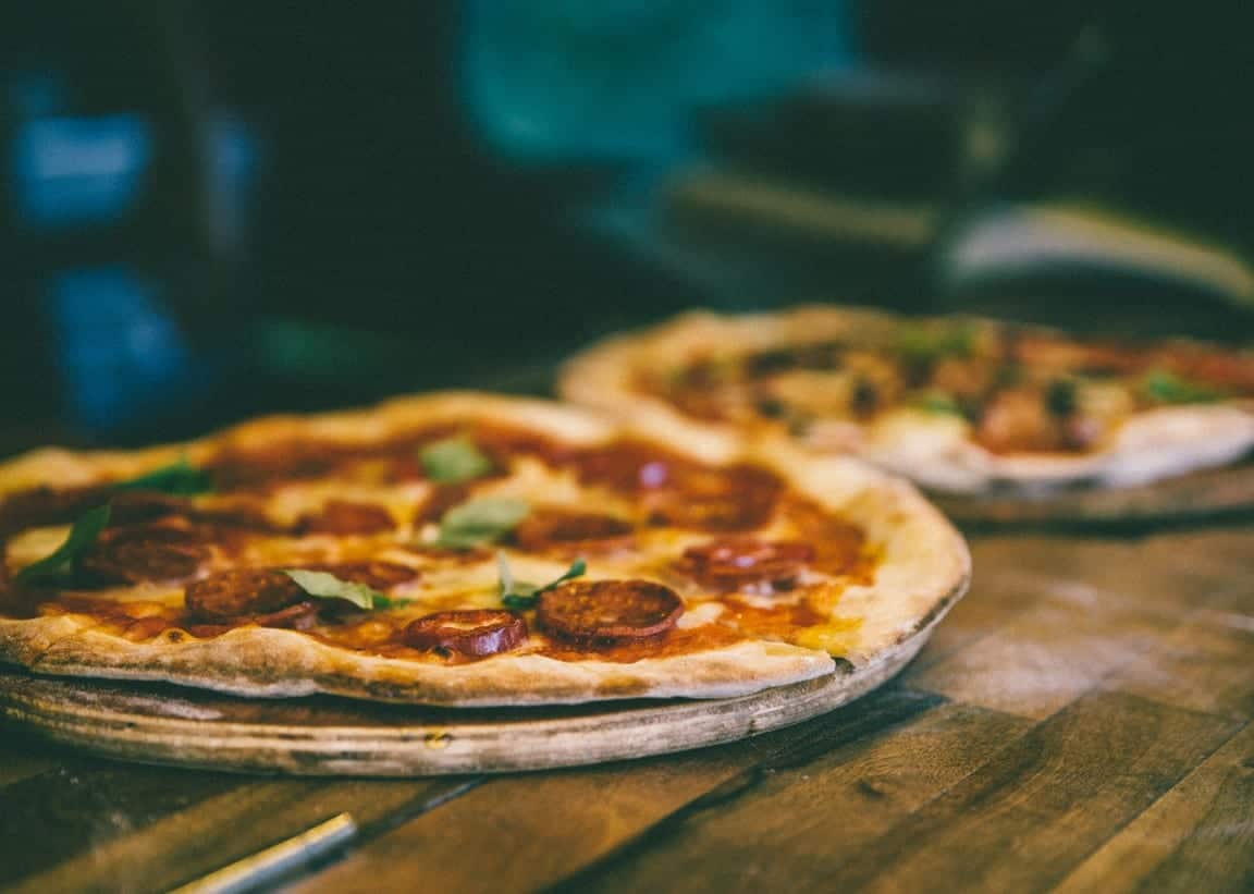 A wood-fired pizza fresh from the oven
